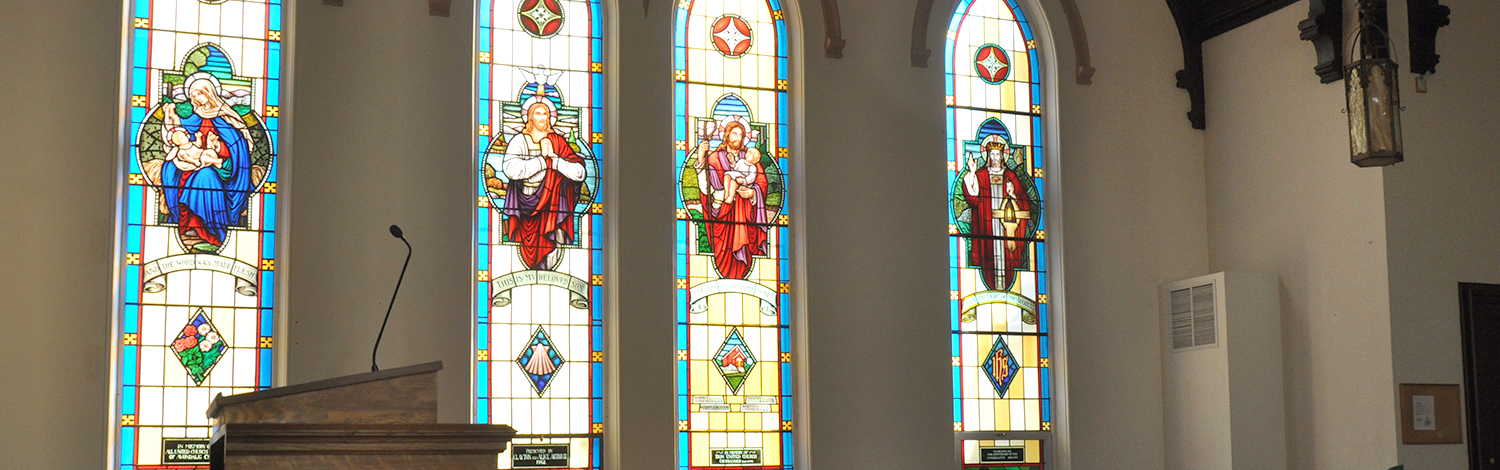 interior of Avondale United Church in Tillsonburg with stained glass windwos