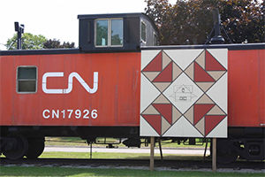 barn quilt square on caboose at Station Arts Centre
