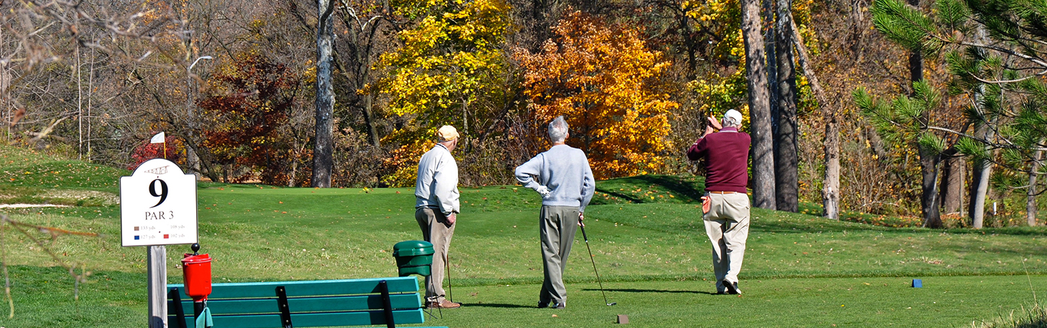 3 male golfers in the fall at The Bridges