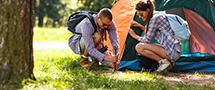 Couple setting up tent