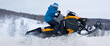 snowmobile rider jumping