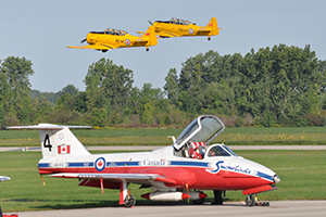 two harvards taking off with Snowbirds tutor jet underneath at Tillsonburg Regional Airport