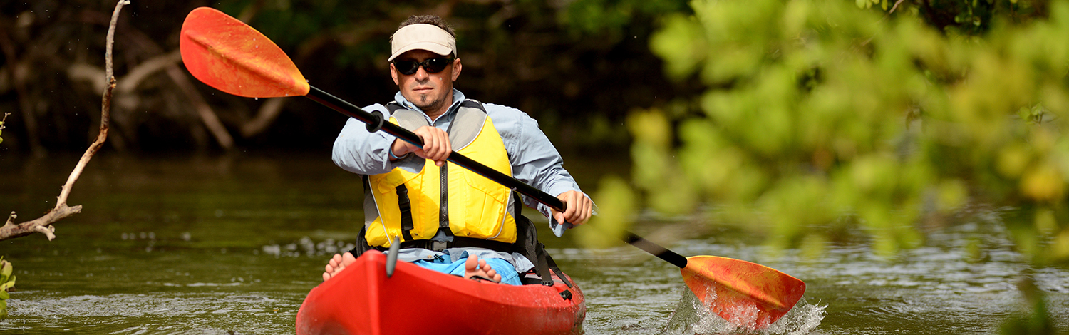 man in kayak on river